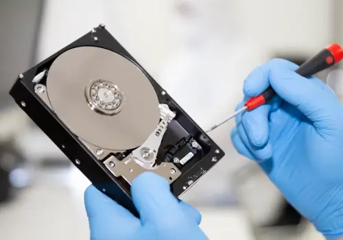 Engineers performing data recovery on a hard drive.